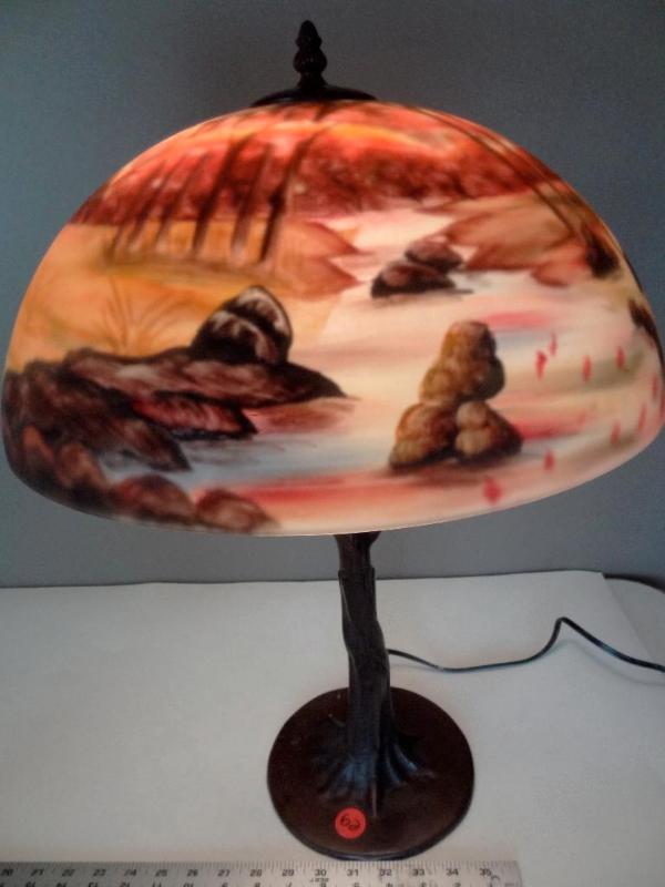 Reverse painted lamp with cast meta...
