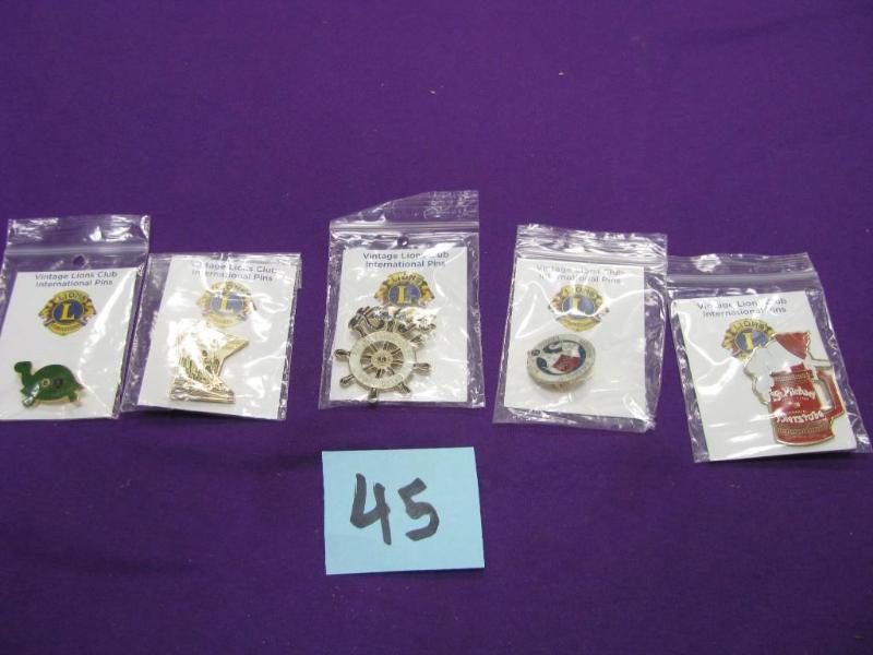 five vintage Lions club pins, biers...