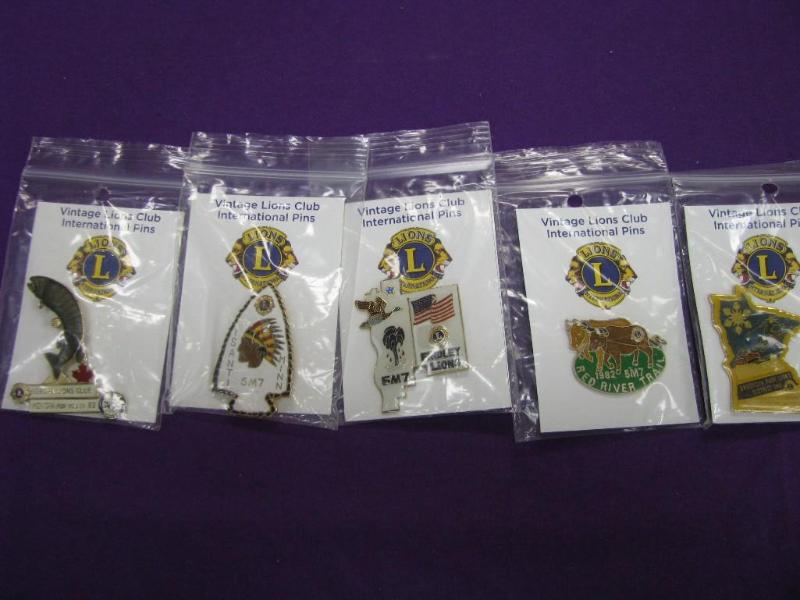 five vintage Lions club pins...