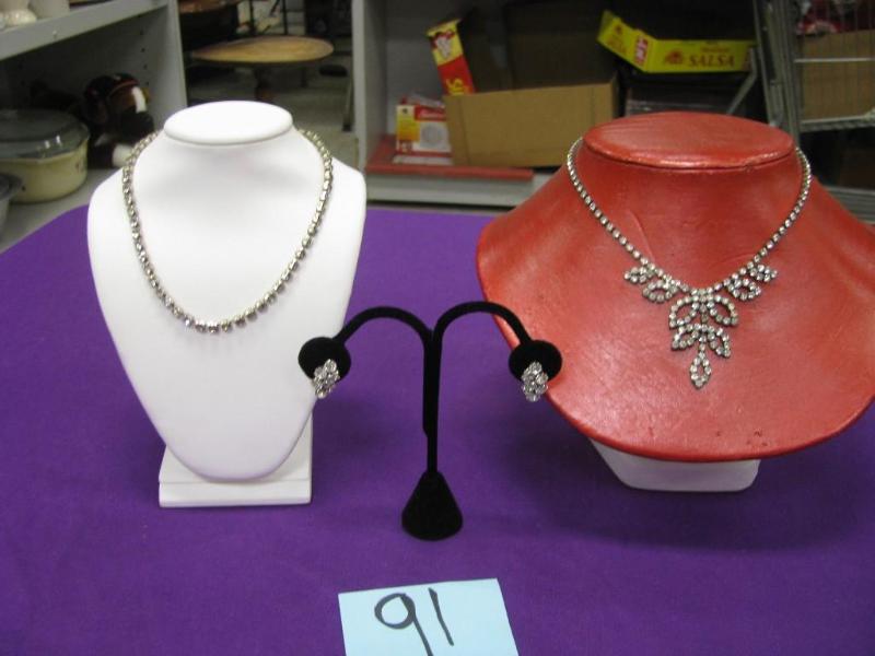 one pair of earrings and two rhines...