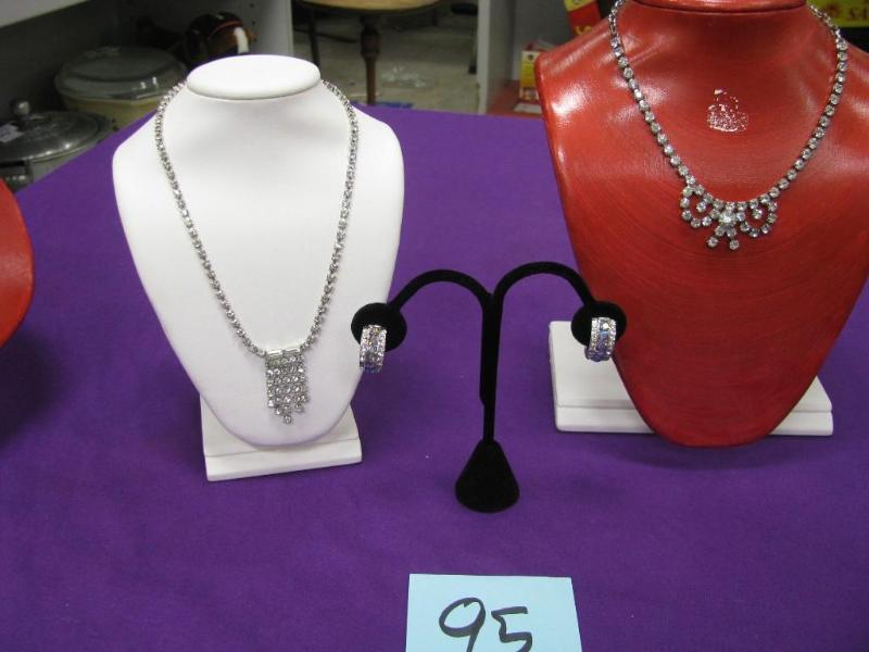 one pair of earrings and two rhines...