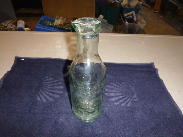 lot 176 image: Old Glass Milk Bottle...