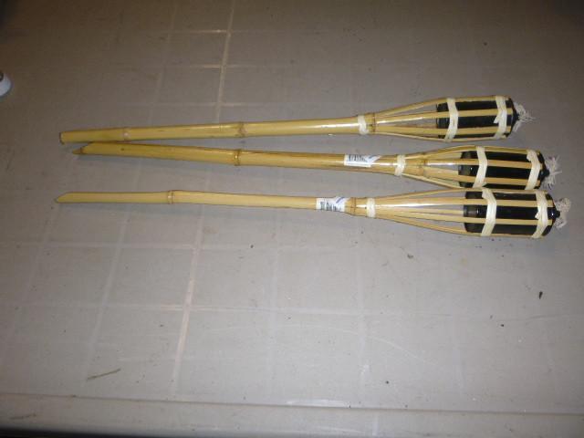 lot 209 image: 3 Small Tiki Torches...