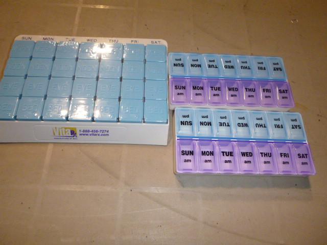 lot 229 image: 3 Multi-Day Pill Storage Containers...