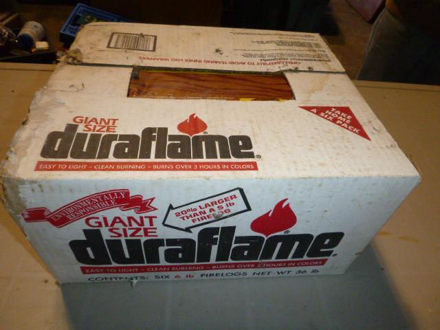 lot 86 image: Case of Duraflame Giant Size Logs C...