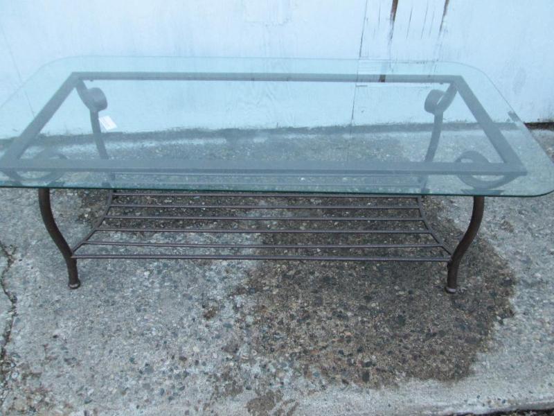 Glass top table with nice metal bas...