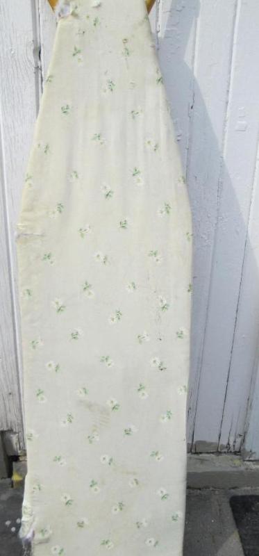 Ironing board, tear in cover...