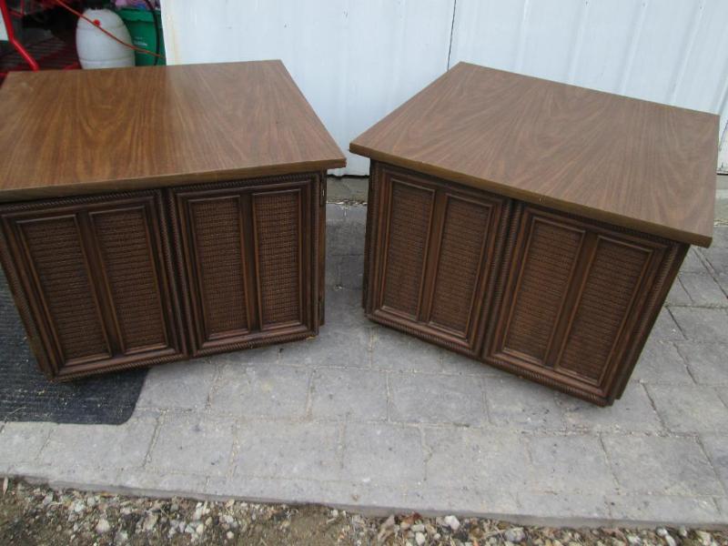 pair of brown end tables with stora...
