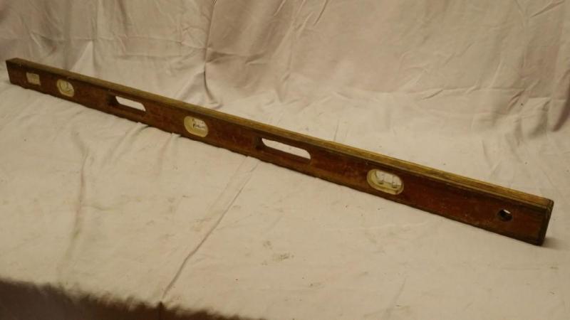 lot 11 image: 4 foot long carpenters level made o...