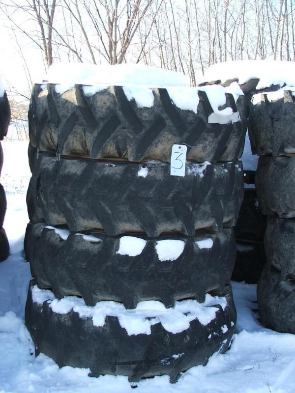 lot 27 image: A set of four 10 bolt rims and foam...