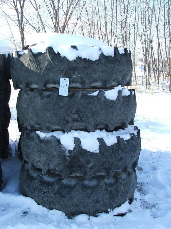 lot 28 image: A set of four 10 bolt rims and foam...