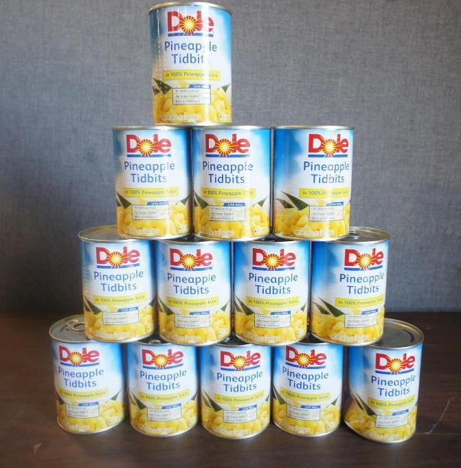 lot 18 image: 13 cans of Dole Pineapple Tidbits i...
