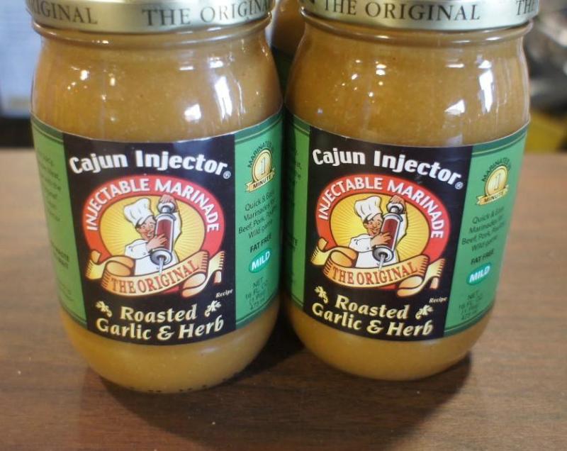 lot 45 image: 4 bottles of Cajun Injector Injecta...