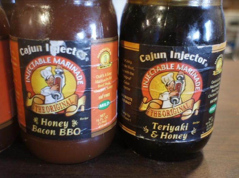 lot 48 image: 6 bottles of Cajun Injector Injecta...