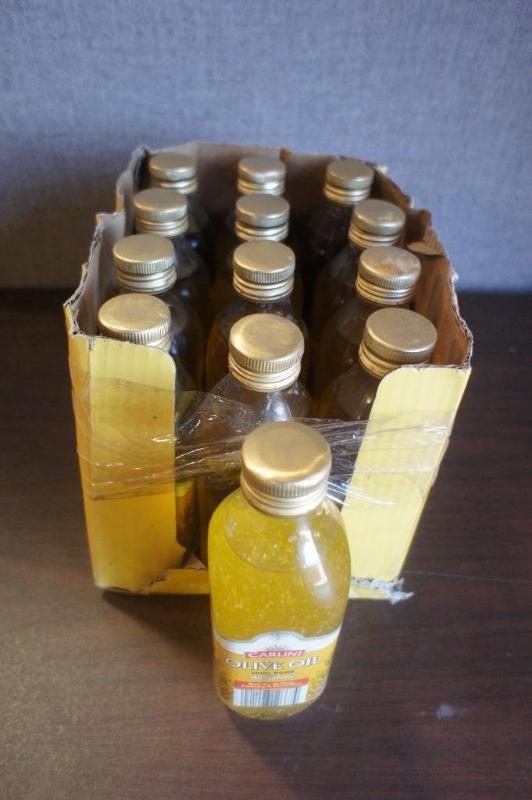 lot 51 image: Lot of (13) Carlini Olive Oil 100% ...