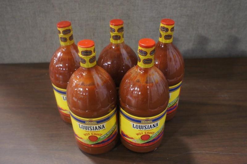 lot 72 image: Lot of (5) Louisiana Hot Sauce, 32 ...