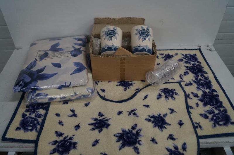 Bathroom rug, curtain, and soap dis...