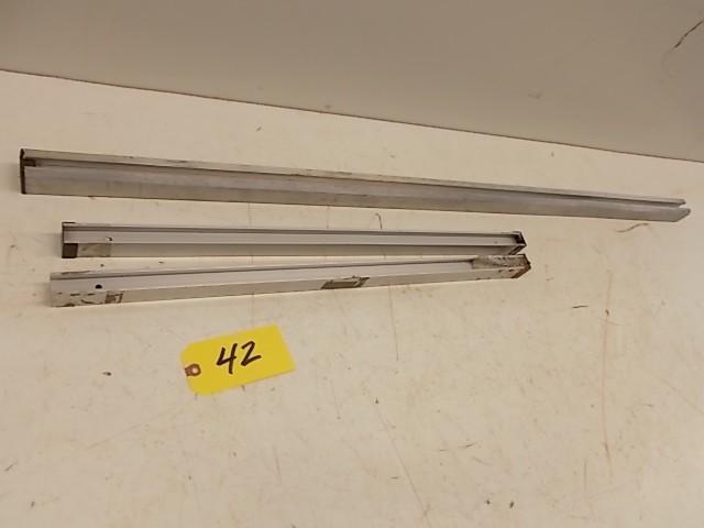 lot 42 image: (3) Aluminum Power Feed Stop Bracke...