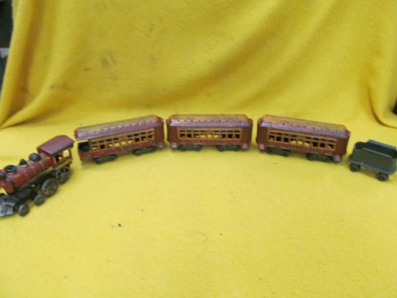 lot 150 image: 5 Piece Cast Iron Tain Set, Cars ar...