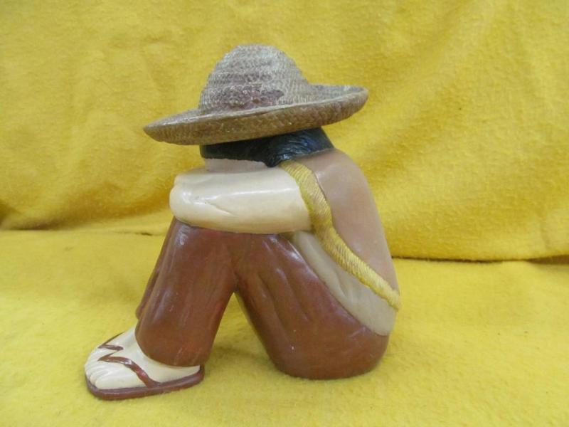 lot 7 image: Ceramic Boy Figure Taking a Nap...