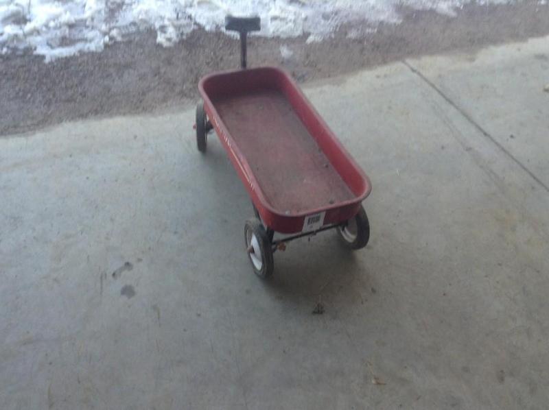 lot 35 image: Red Radio Flyer wagon, slight bend ...