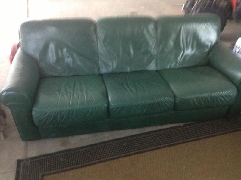 lot 41 image: Green leather sofa and love seat, i...