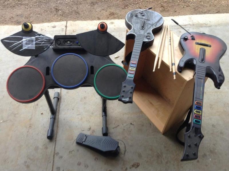 lot 53 image: Guitar Hero Drums with 4 drum stick...