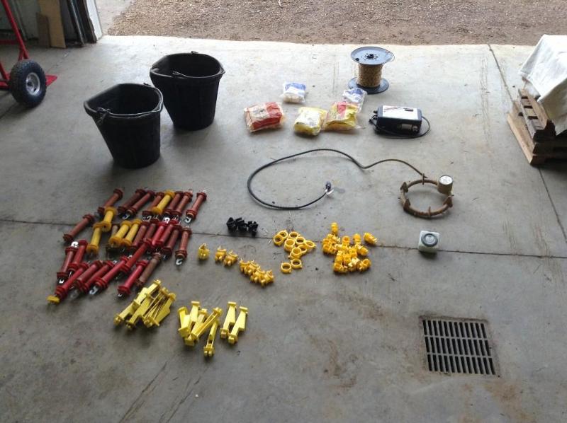 lot 77 image: Two buckets of electric fence parts...