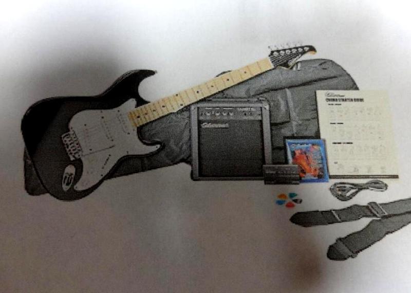 lot 16 image: SILVERTONE BLACK ELECTRIC GUITAR KI...