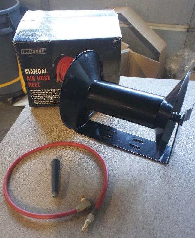 Manual Air Hose Reel. Dented on one...