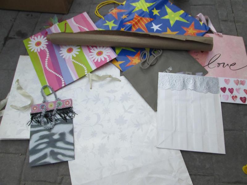 lot 21 image: Assorted gift bags and wraping pape...