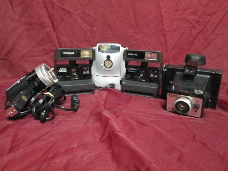 lot 108 image: Several generations of Polaroid cam...