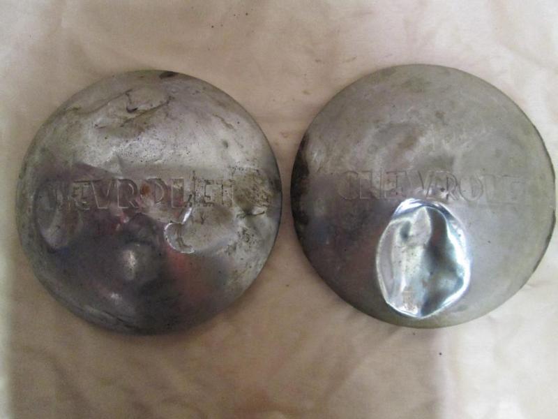 lot 123 image: Chevrolet hub cap centers....