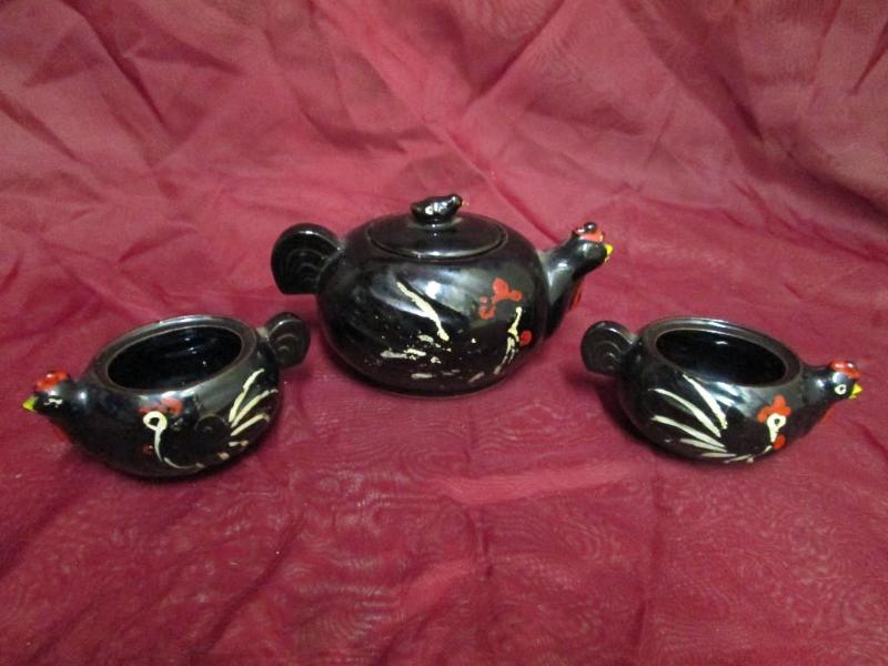 lot 49 image: Vintage black rooster tea set. Tea ...