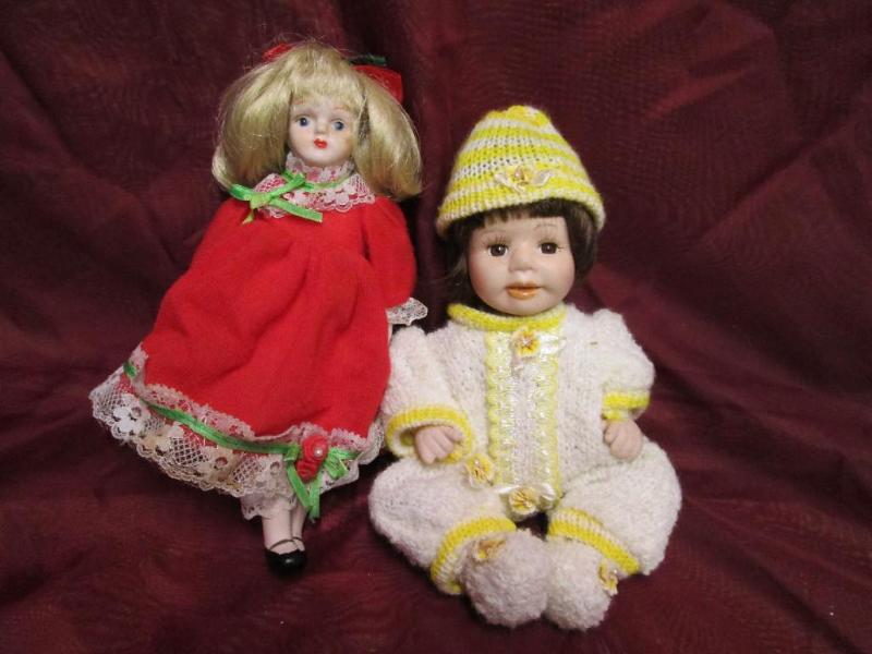 lot 81 image: Pair of vintage porcelain dolls in ...