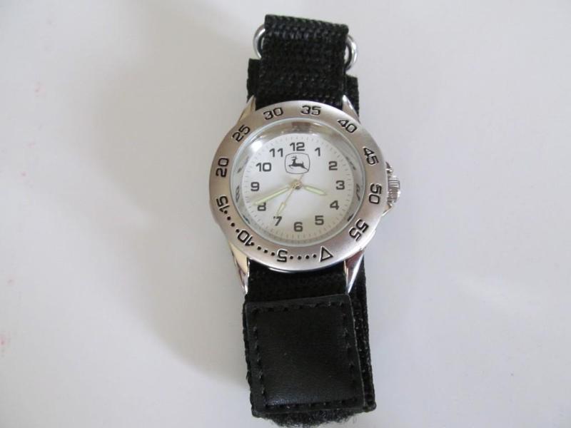lot 15 image: John Deere watch,brand new....