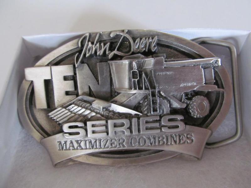 lot 17 image: John Deere belt buckle,brand new....