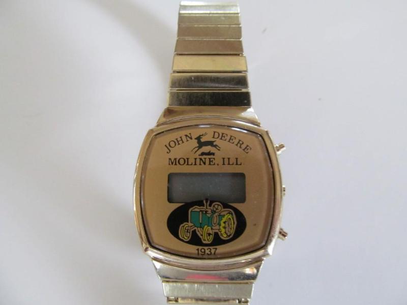 lot 23 image: John Deere watch,1937 depiction....