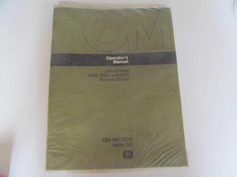 lot 43 image: John Deere Snowmobile Manual....