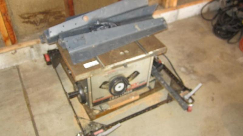 lot 37 image: craftsman table saw, table and stan...