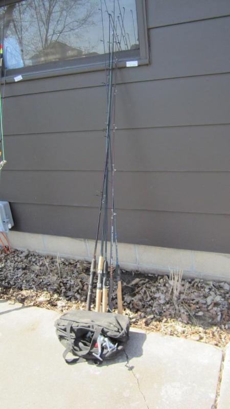 lot 71 image: fishing poles with bag of reels...