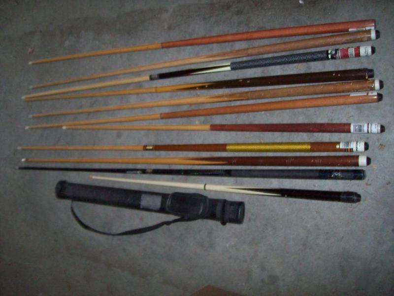 Assortment of pool sticks item 26...