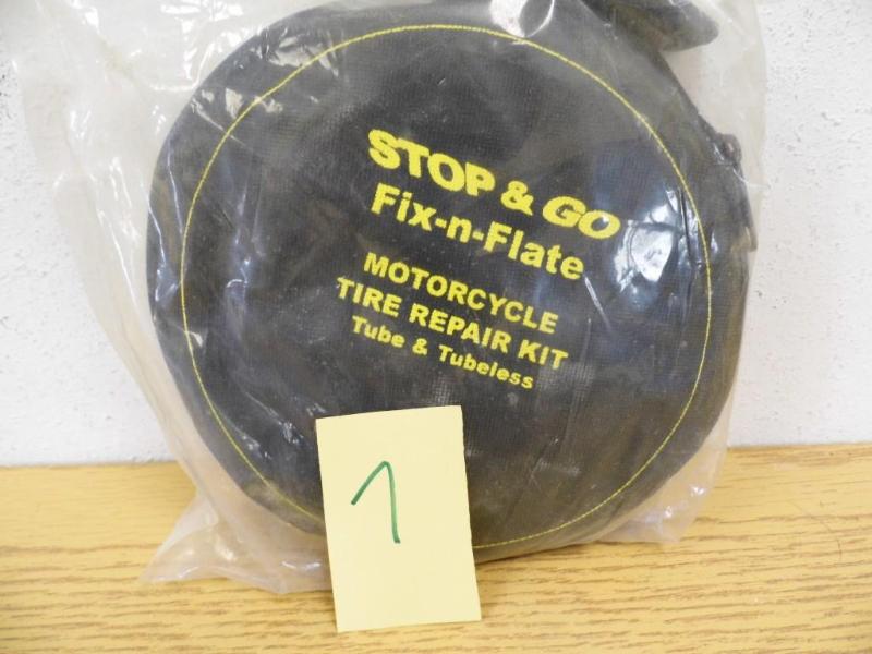 lot 7 image: Stop & Go Fix-n-Flate Motocycle...