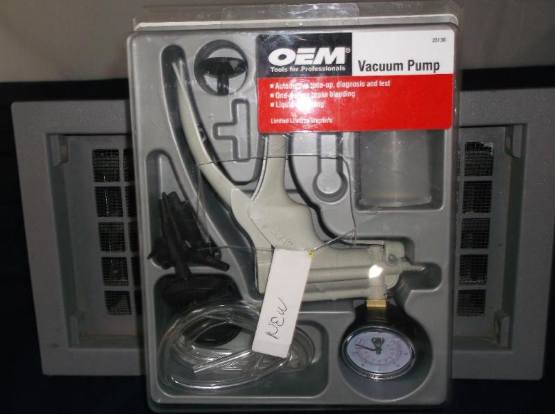 lot 11 image: OEM vacuum pump. Appears to be unus...