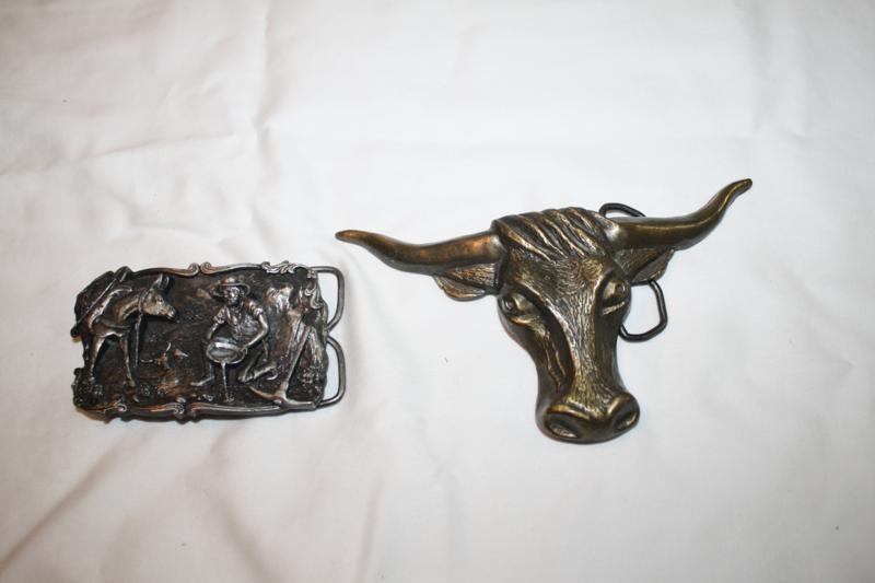 lot 147 image: 2 vintage metal belt buckles. the l...