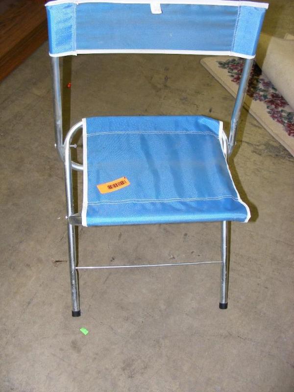small blue fold up lawn chair...