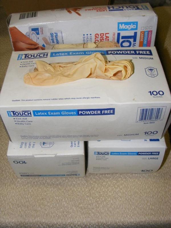 4 boxes of Rubber Gloves, 3 opened&...