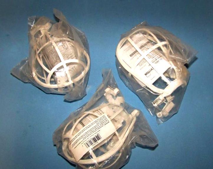 lot 43 image: (3) Leviton, Light Bulb Protectors
