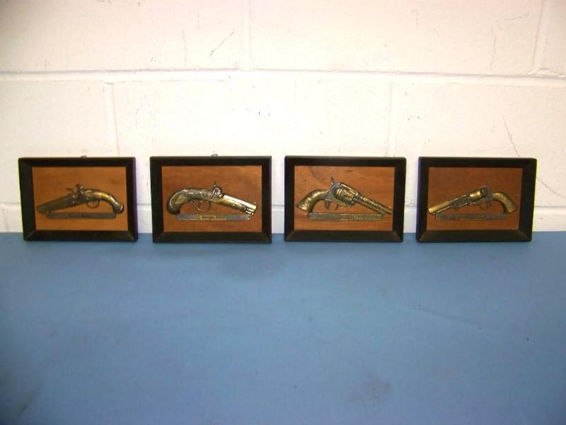 lot 62 image: (4) Gun Motif, Raised Metal, Art Pieces