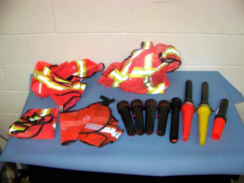 lot 89 image: (4) Orange  Reflective Vests and (8) Flashlights